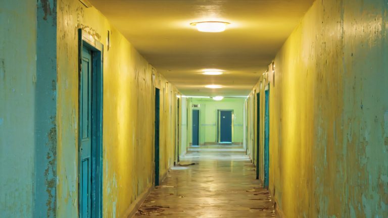 abandoned asylum corridor flickering fluorescent lights scaled