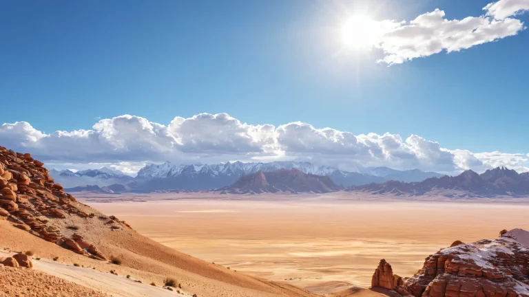 A serene and photorealistic image of a mountain range against a clear blue sky, with rugged rocks and sandy dunes in the foreground.